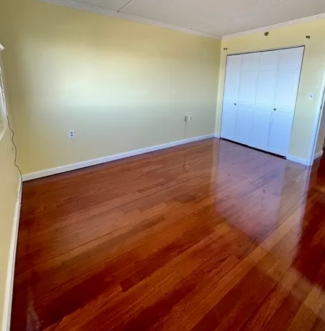 a room with a bed and a window