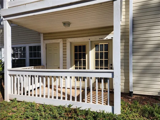 a view of a porch with a door