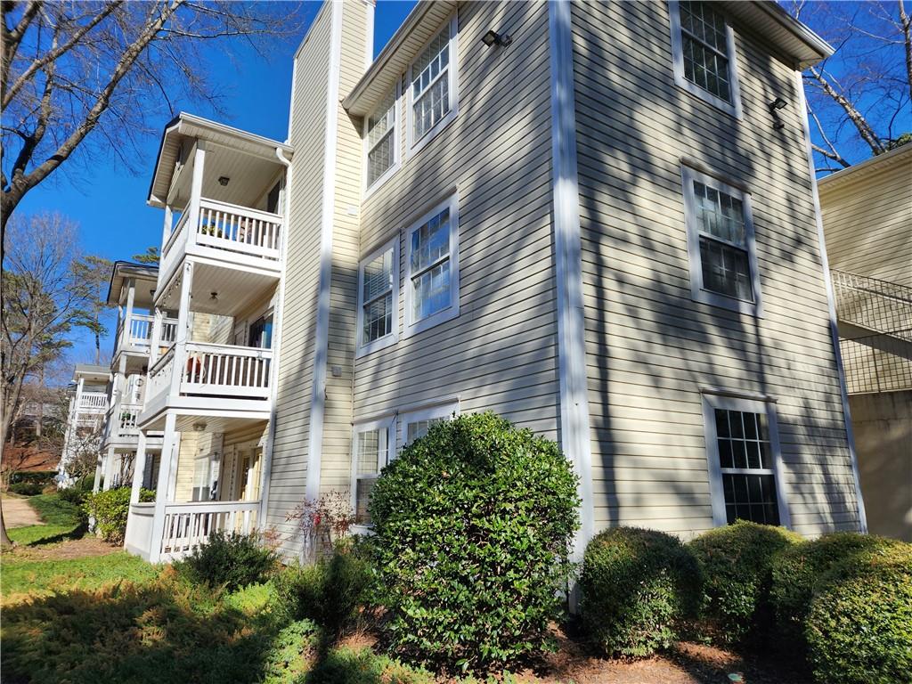 1411 Keys Crossing Drive Northeast Brookhaven, GA 30319 - Photo 23 of 24 a front view of a multi story residential apartment building