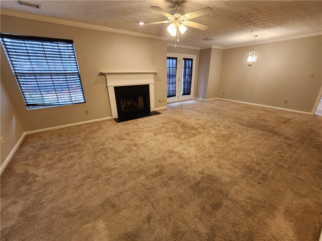 1411 Keys Crossing Drive Northeast Brookhaven, GA 30319 - Photo 7 of 24 an empty room with windows and fireplace