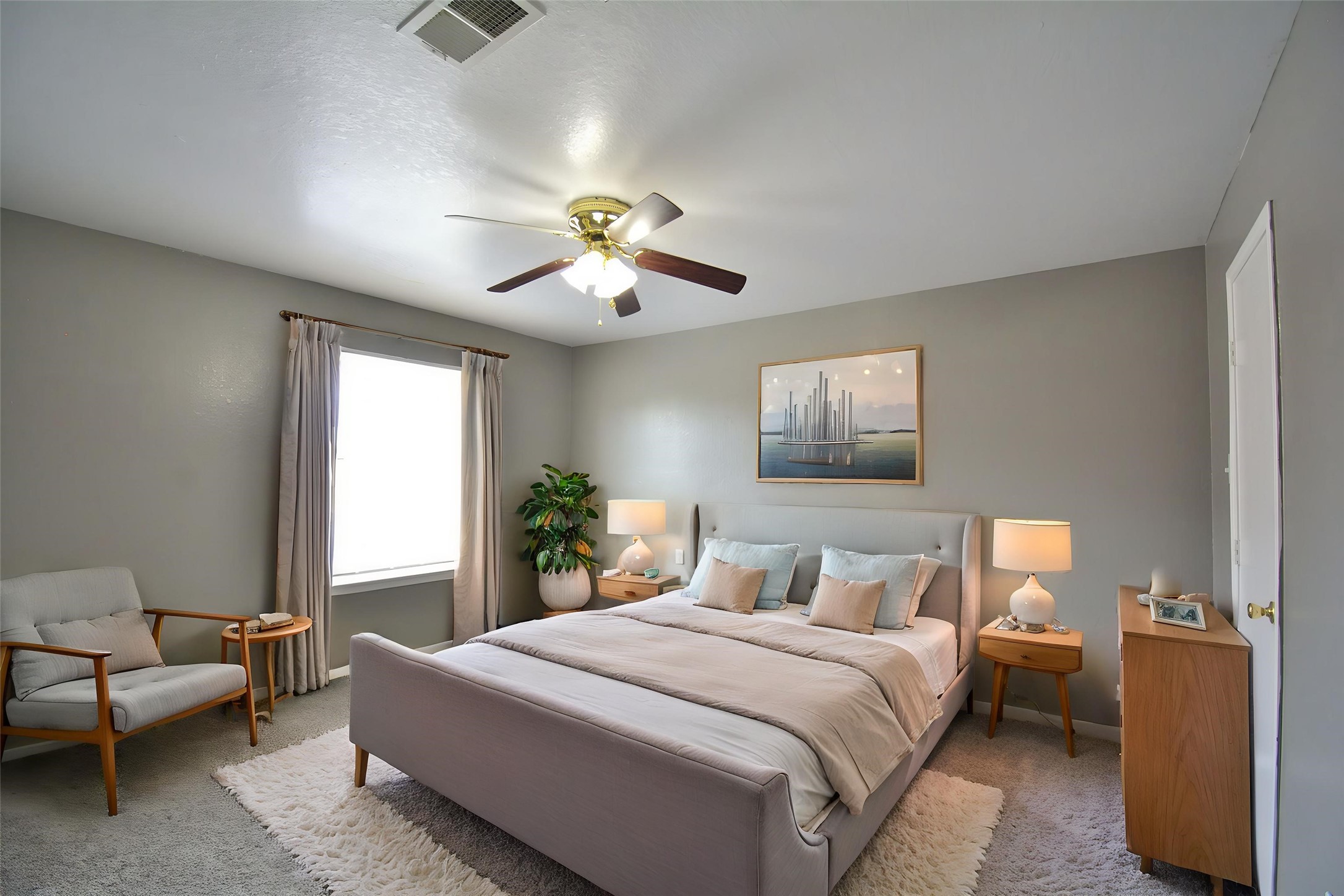 8904 Ledge Street Houston, TX 77075 - Photo 12 of 20 a bedroom with a bed and a chandelier