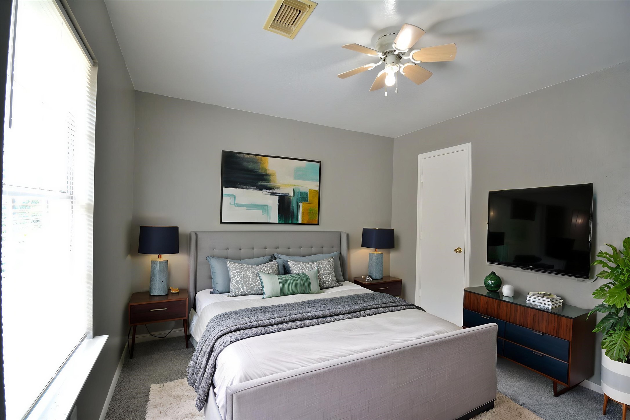 8904 Ledge Street Houston, TX 77075 - Photo 16 of 20 a bedroom with a bed and a flat screen tv