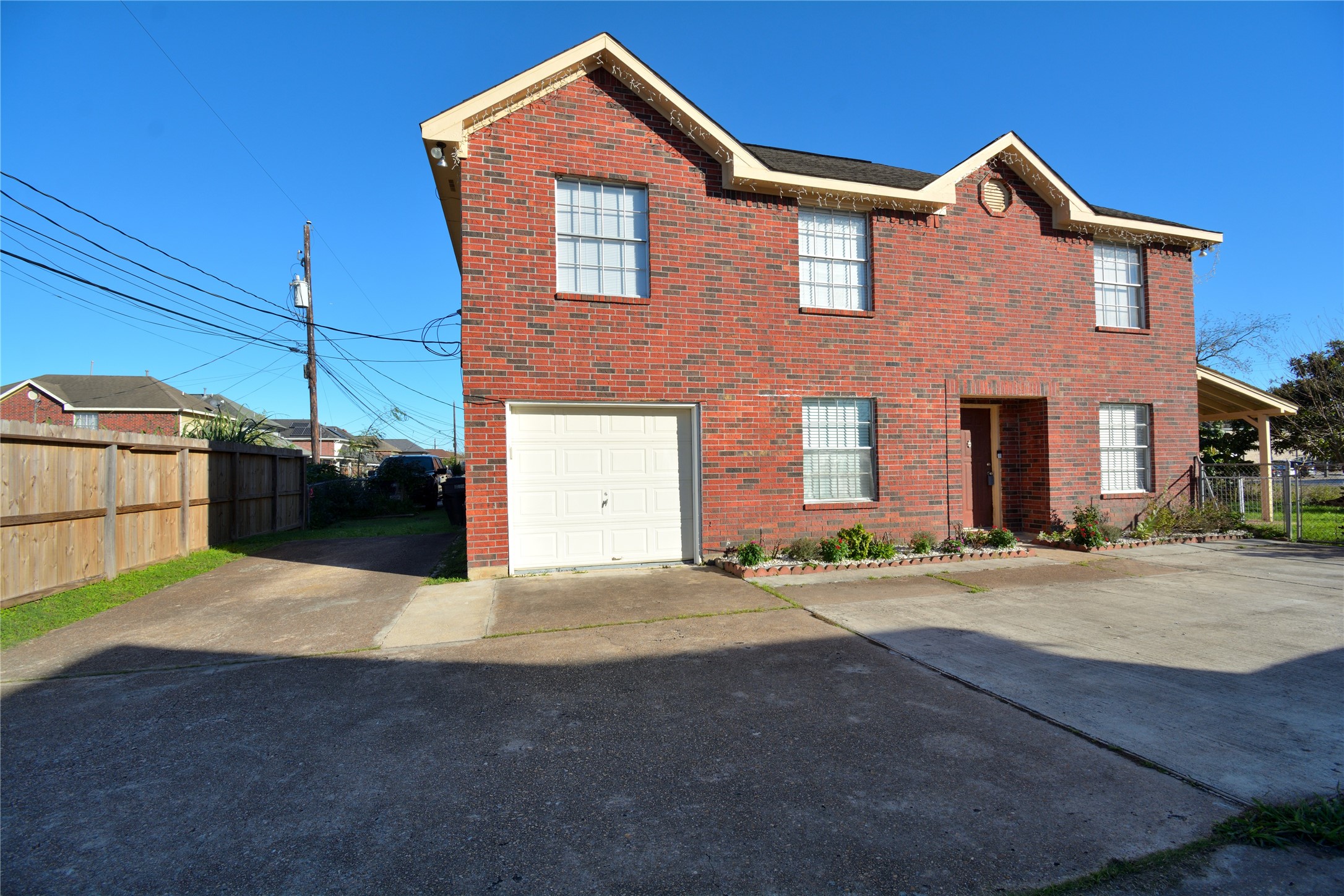8904 Ledge Street Houston, TX 77075 - Photo 2 of 20 a front view of a house with parking space