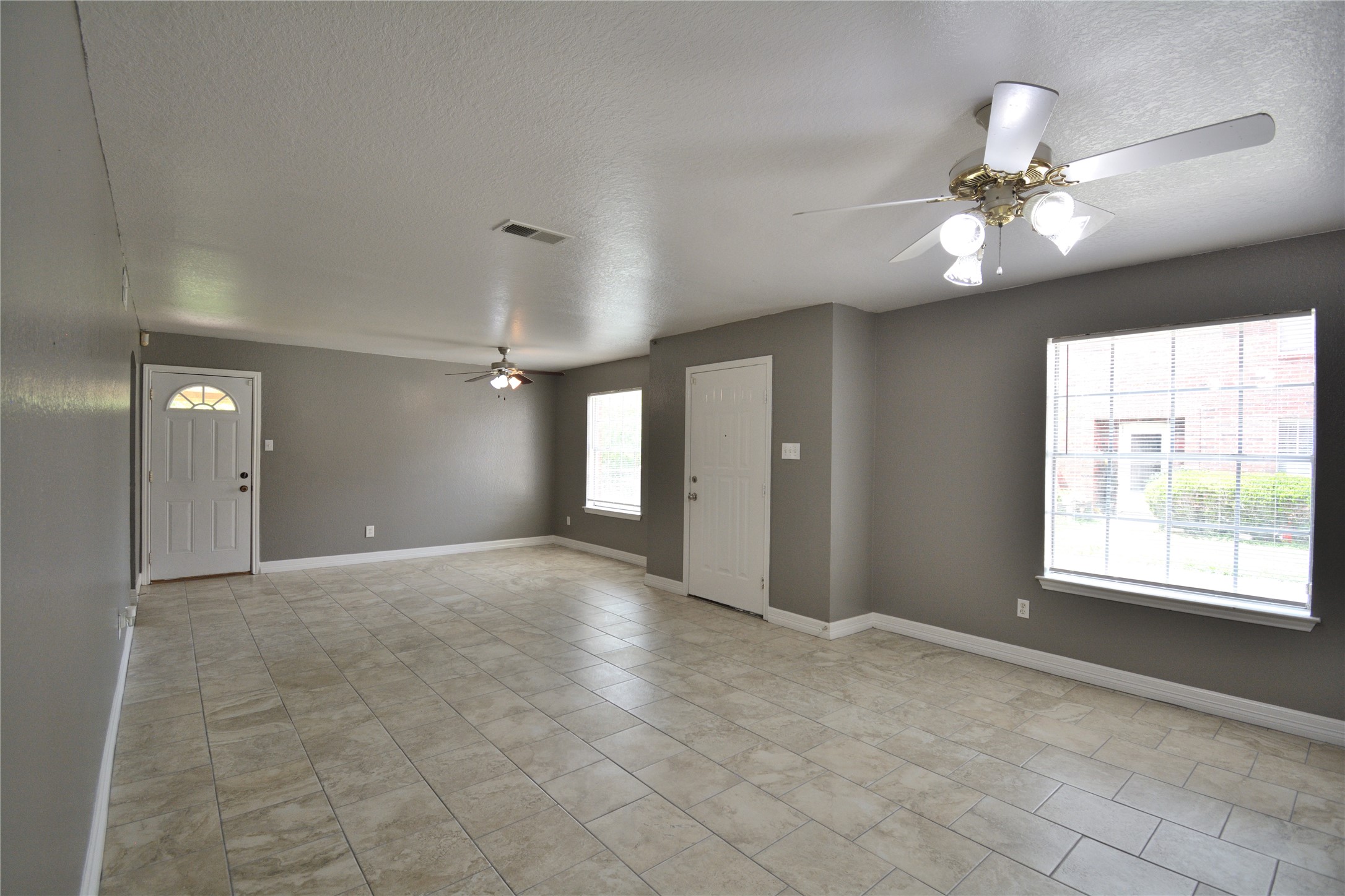 8904 Ledge Street Houston, TX 77075 - Photo 7 of 20 a view of an empty room with a window