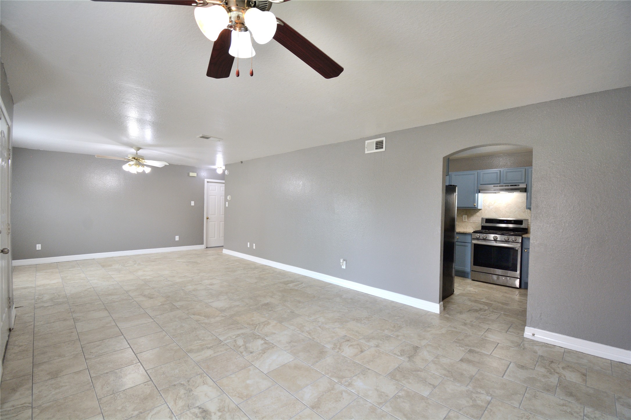 8904 Ledge Street Houston, TX 77075 - Photo 8 of 20 a view of an empty room and kitchen view