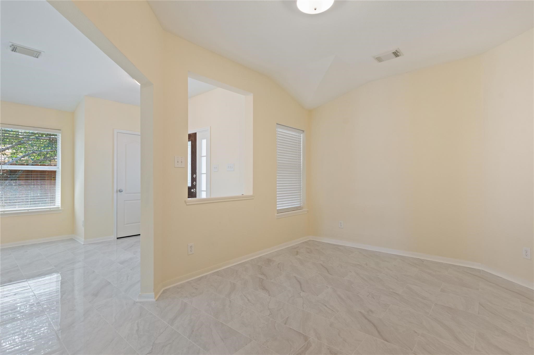 7710 Sapulpa Lane Cypress, TX 77433 - Photo 6 of 15 an empty room with windows