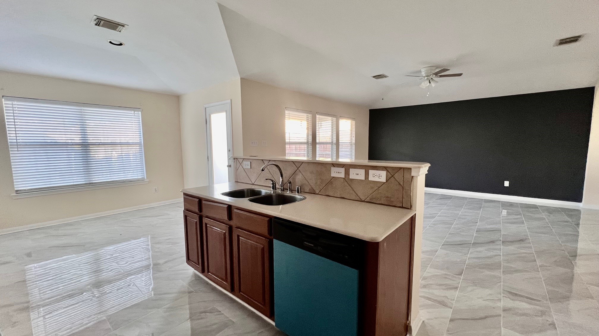 7710 Sapulpa Lane Cypress, TX 77433 - Photo 7 of 15 a kitchen with a sink and a stove