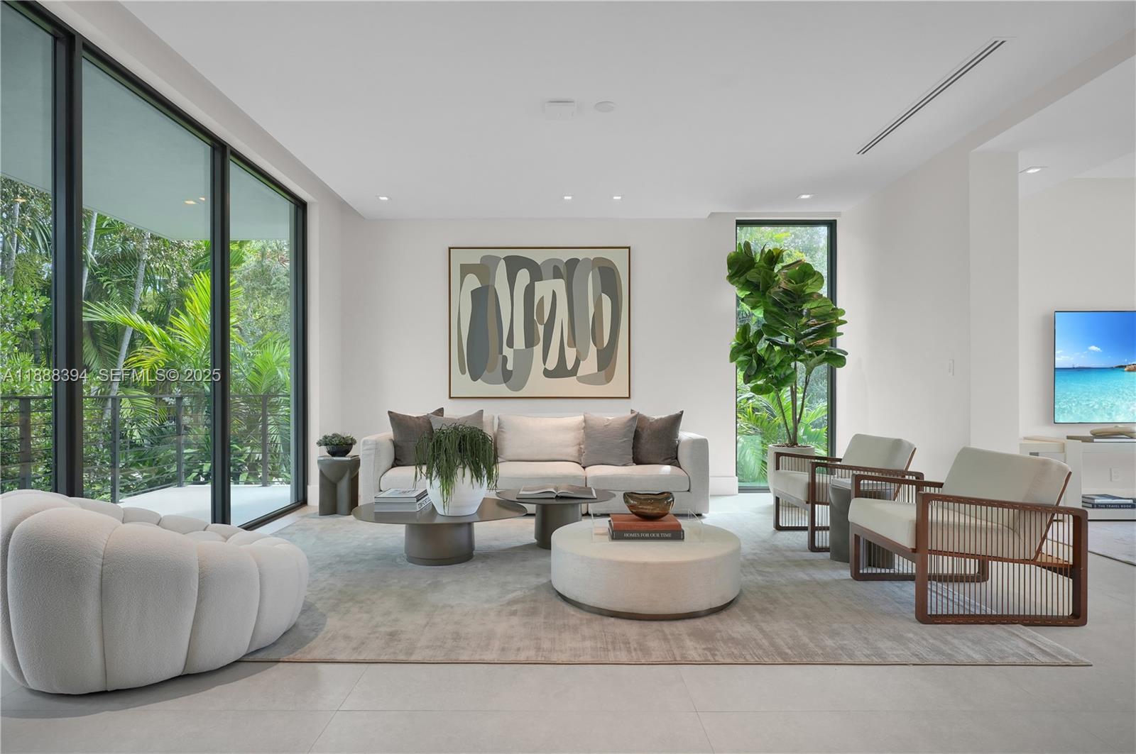 100 Hampton Lane Key Biscayne, FL 33149 - Photo 8 of 35 a living room with furniture and a potted plant