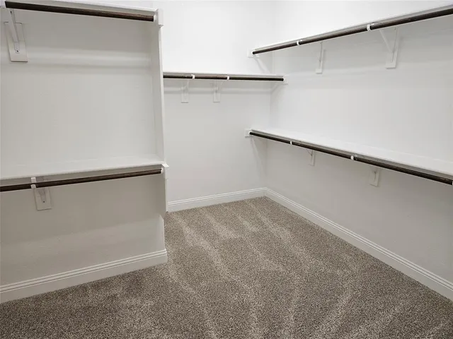 an empty room with a empty space and a ceiling fan