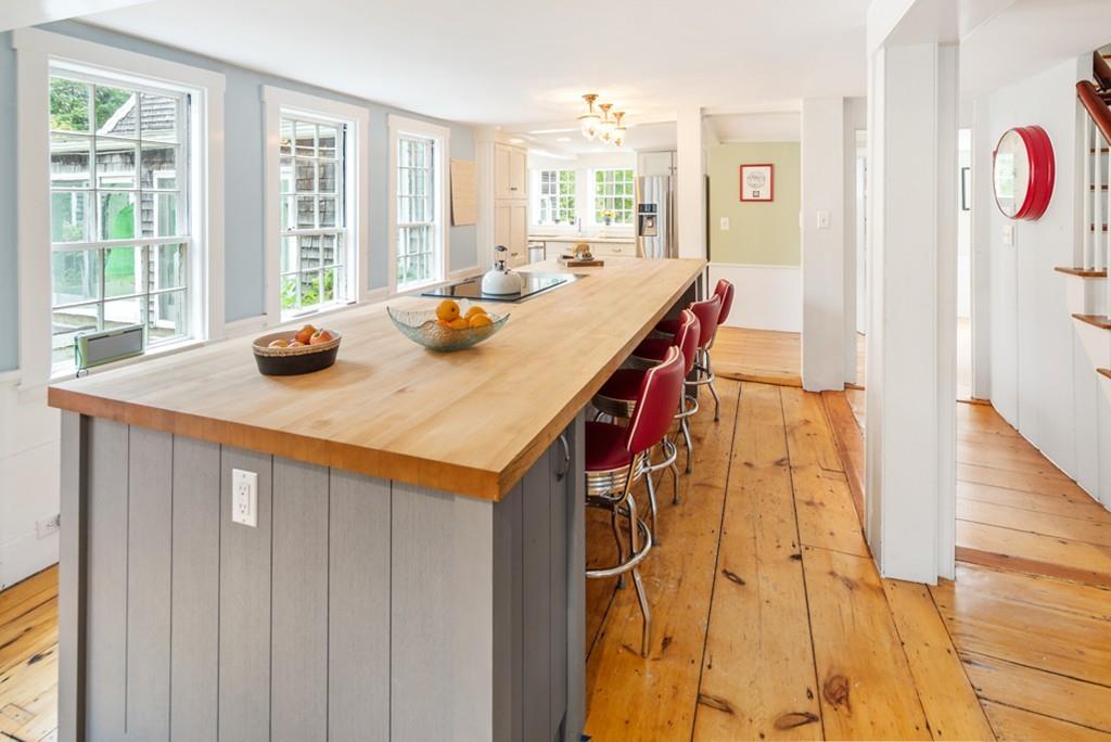 347 Main Street Hingham, MA 02043 - Photo 13 of 34 a kitchen with a sink and wooden cabinets