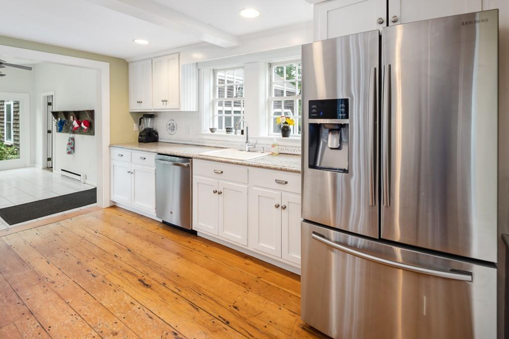 347 Main Street Hingham, MA 02043 - Photo 16 of 34 a kitchen with stainless steel appliances a refrigerator sink and microwave