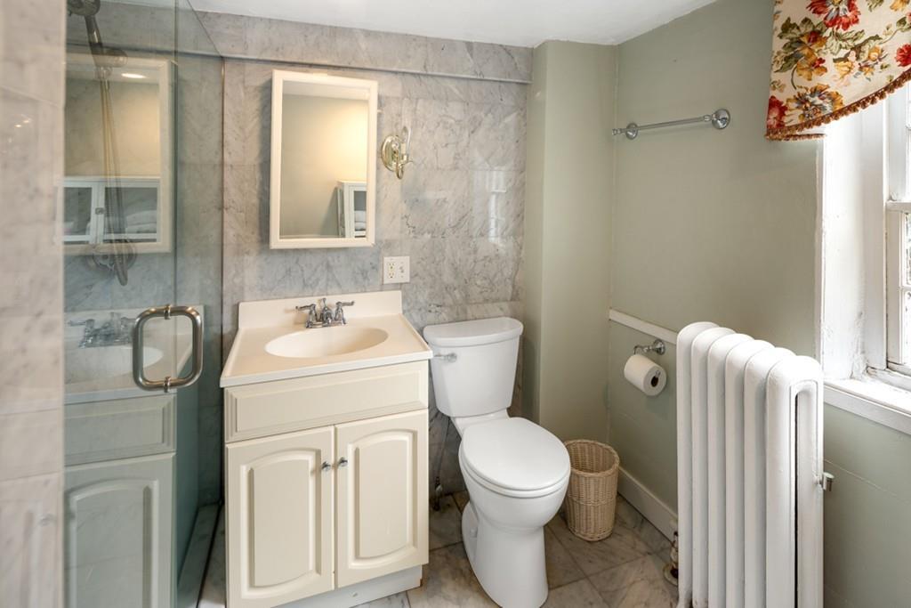 347 Main Street Hingham, MA 02043 - Photo 22 of 34 a bathroom with a sink toilet and shower