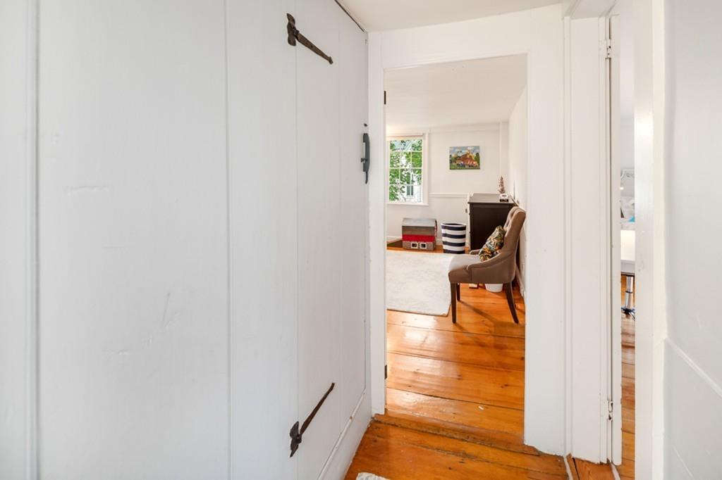 347 Main Street Hingham, MA 02043 - Photo 23 of 34 a view of a hallway with wooden floor and a bathroom