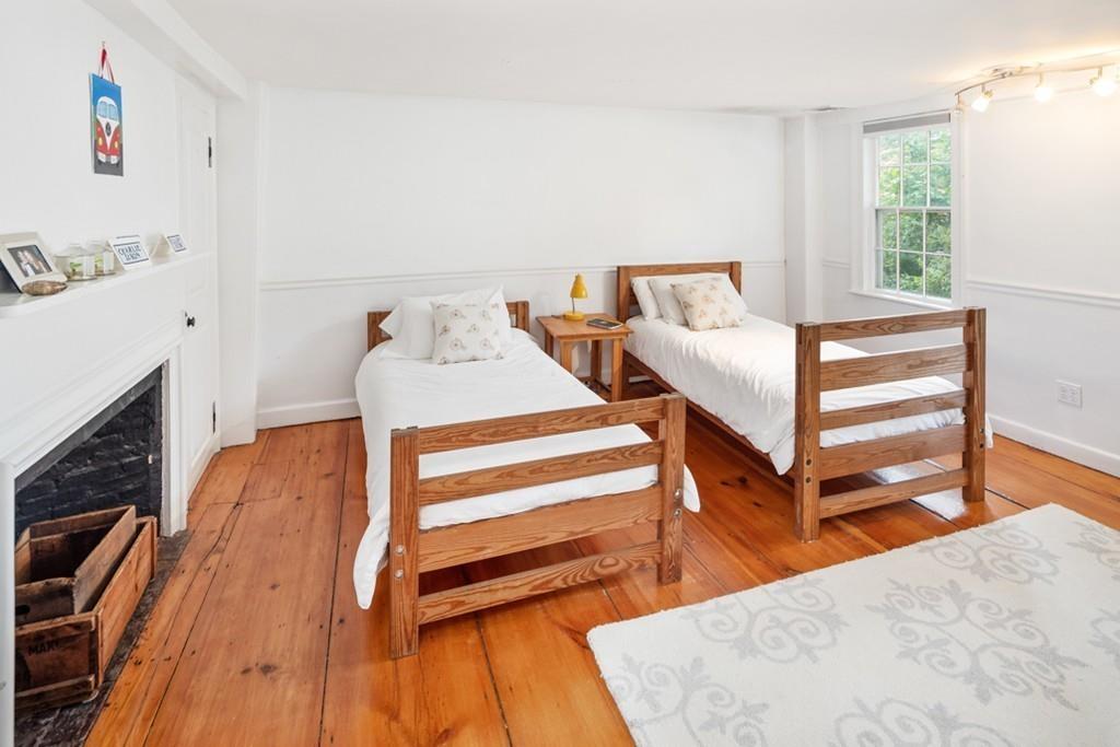 347 Main Street Hingham, MA 02043 - Photo 24 of 34 a bedroom with a bed and a dresser