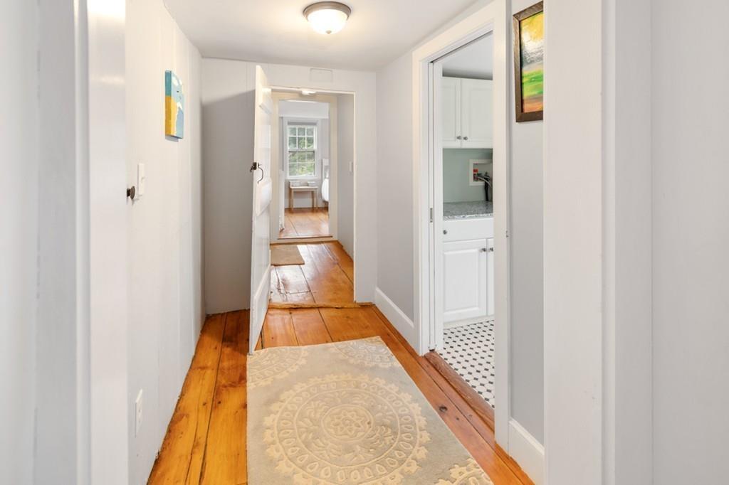 347 Main Street Hingham, MA 02043 - Photo 29 of 34 a view of a hallway with wooden floor and staircase