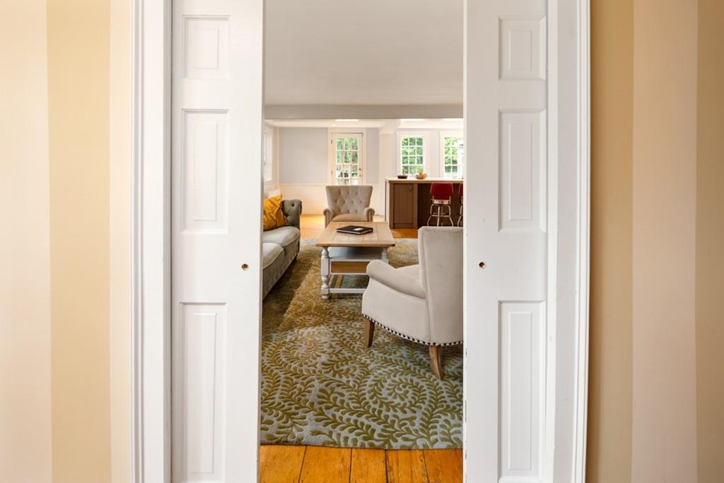 347 Main Street Hingham, MA 02043 - Photo 8 of 34 a living room with furniture and a fireplace