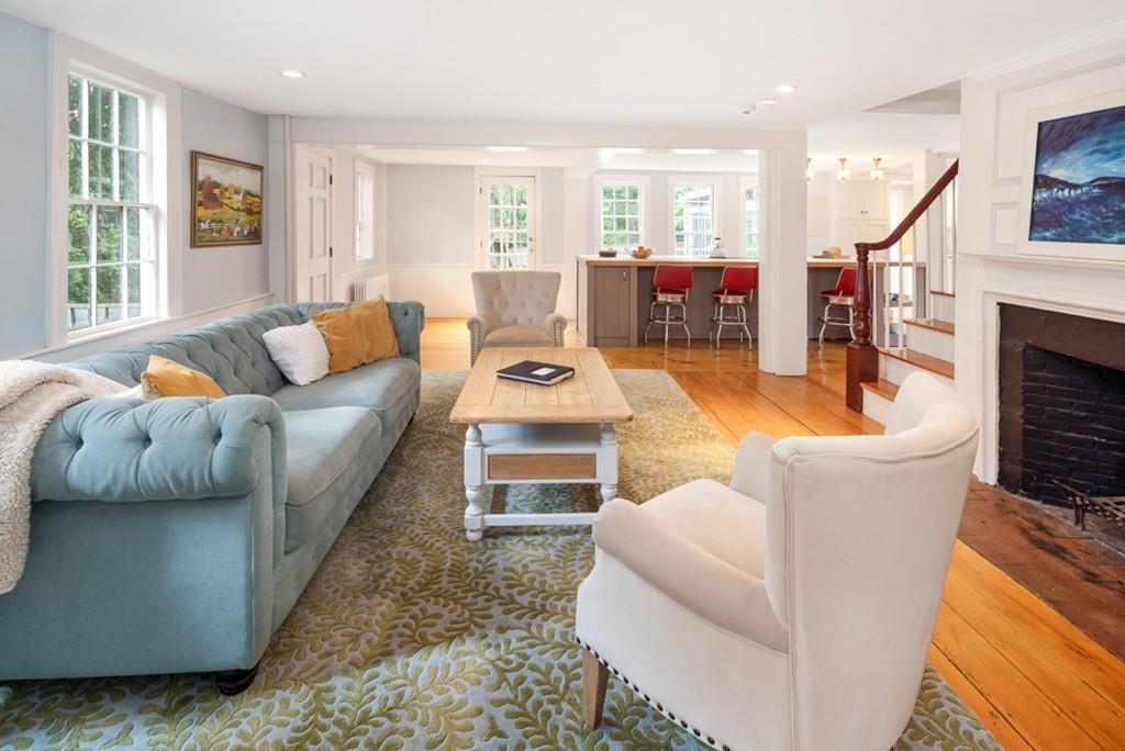 347 Main Street Hingham, MA 02043 - Photo 9 of 34 a living room with furniture a fireplace and a flat screen tv