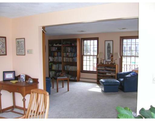 78 Ridge Avenue Newton, MA 02459 - Photo 11 of 11 a living room with furniture a fireplace and large windows
