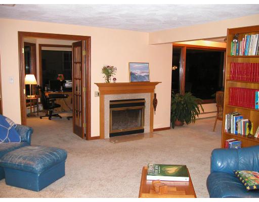 78 Ridge Avenue Newton, MA 02459 - Photo 4 of 11 a living room with furniture and a fireplace