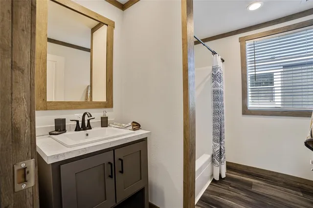 a bathroom with a sink and a mirror