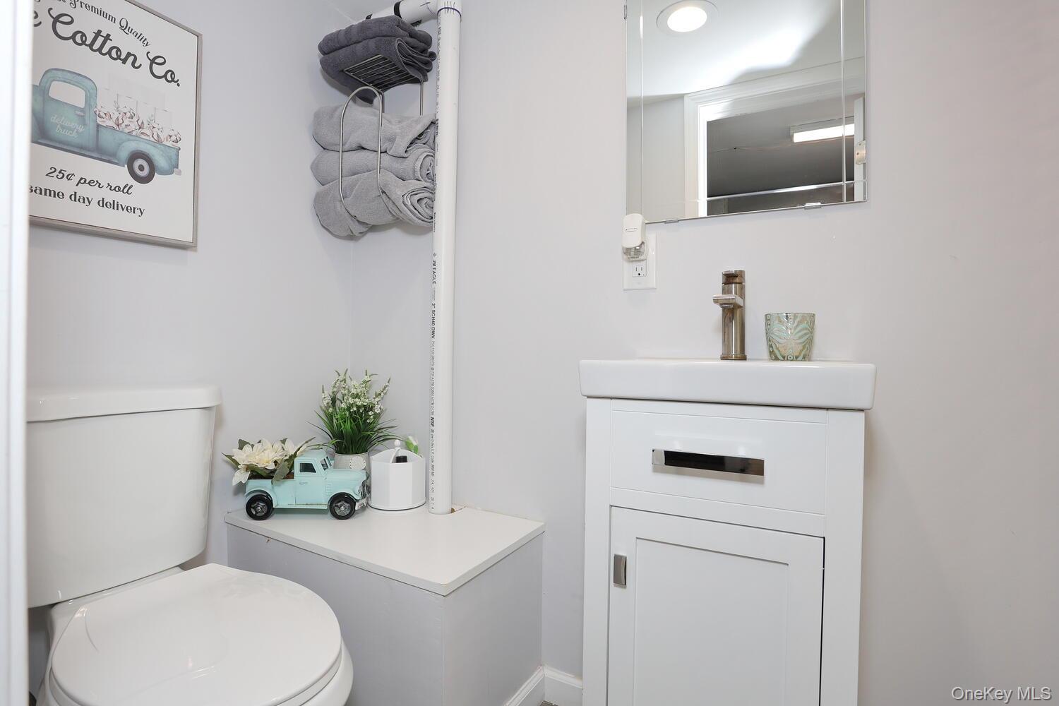 19 Augur Road Suffern, NY 10901 - Photo 23 of 35 a bathroom with a toilet sink and mirror
