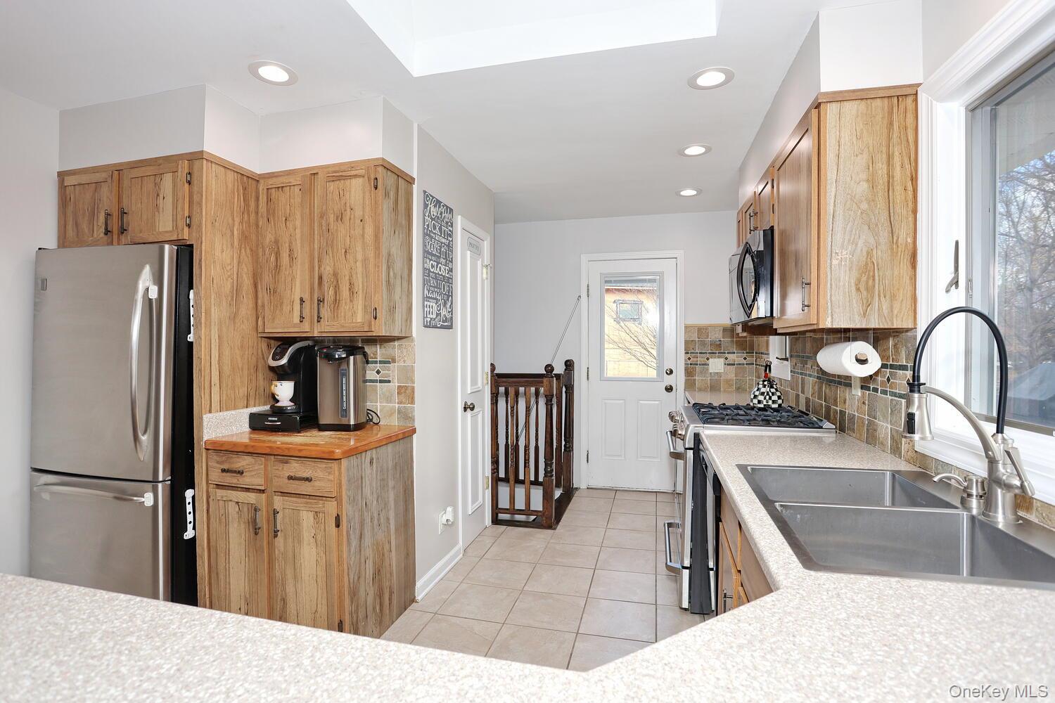 19 Augur Road Suffern, NY 10901 - Photo 10 of 35 a kitchen with granite countertop a refrigerator and a sink