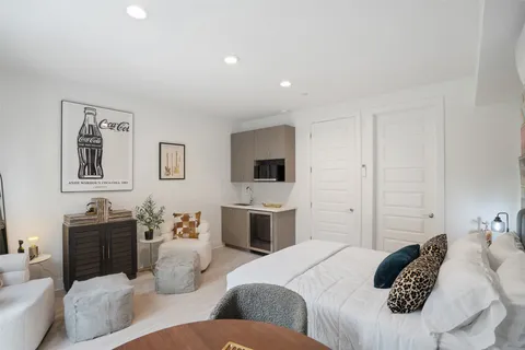 a bedroom with a bed and furniture