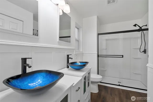 a kitchen with a sink and a refrigerator