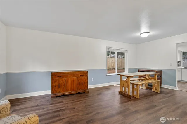 a view of a livingroom with furniture and wooden floor