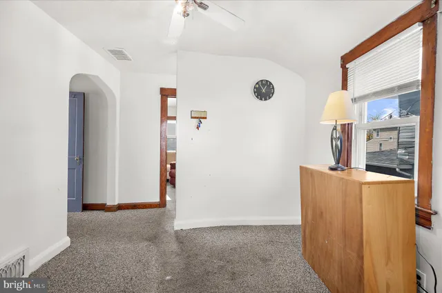 a view of an entryway with kitchen