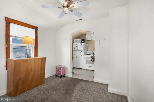 a view of room with workspace and window