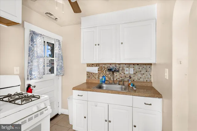 a bathroom with a sink and a window