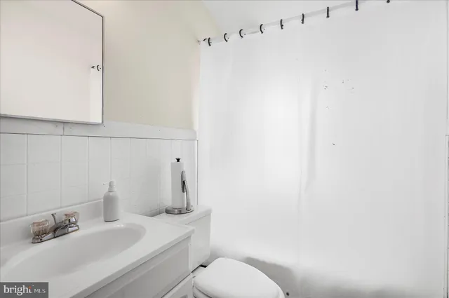 a bathroom with a sink and toilet