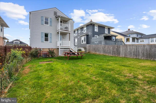 a front view of a house with a yard and porch