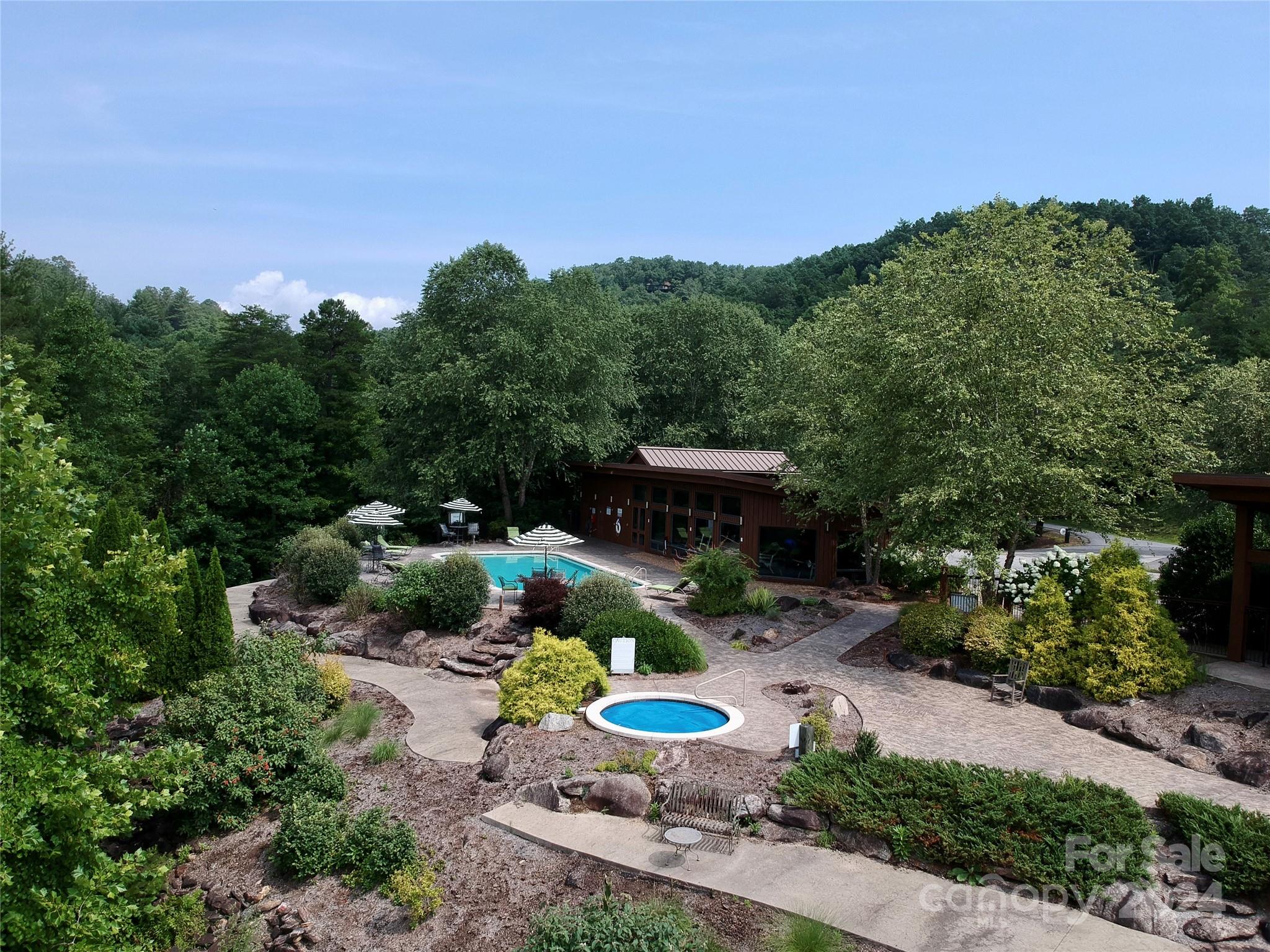 151 Wild Turkey Loop, Unit 29 Marshall, NC 28753 - Photo 22 of 25 a view of a garden with a patio