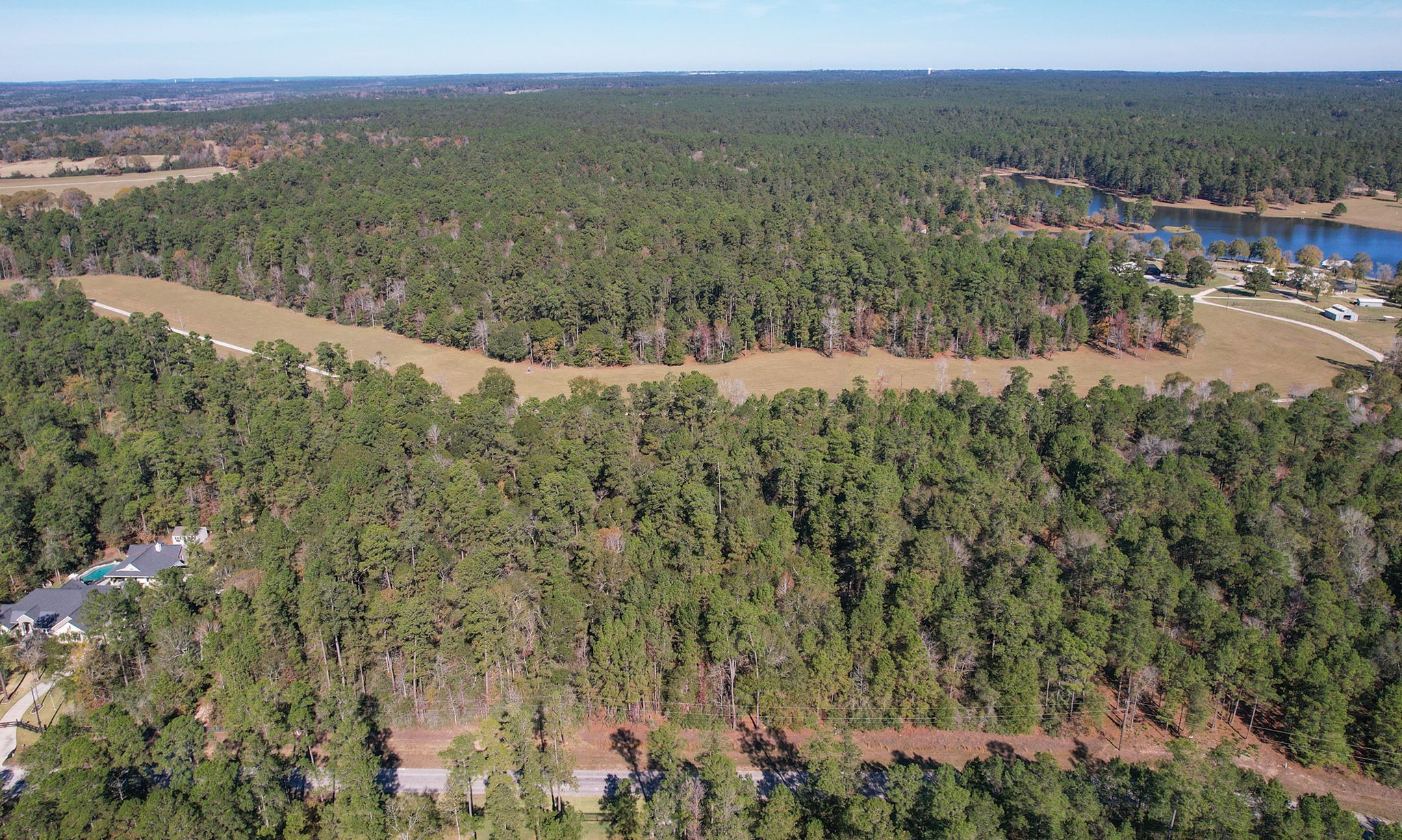Lot 189 Branding Iron Road Huntsville, TX 77340 - Photo 16 of 48 a view of a city with lush green forest