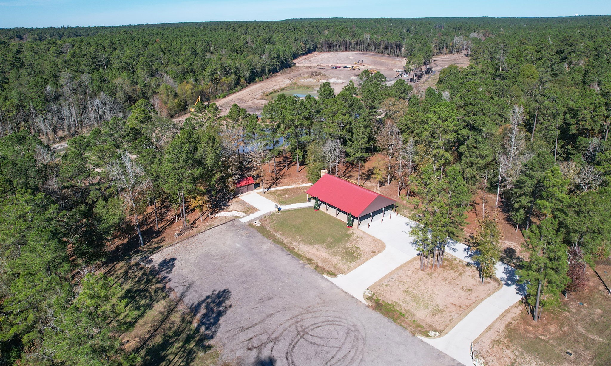 Lot 189 Branding Iron Road Huntsville, TX 77340 - Photo 27 of 48 an aerial view of a house with a yard and lake view