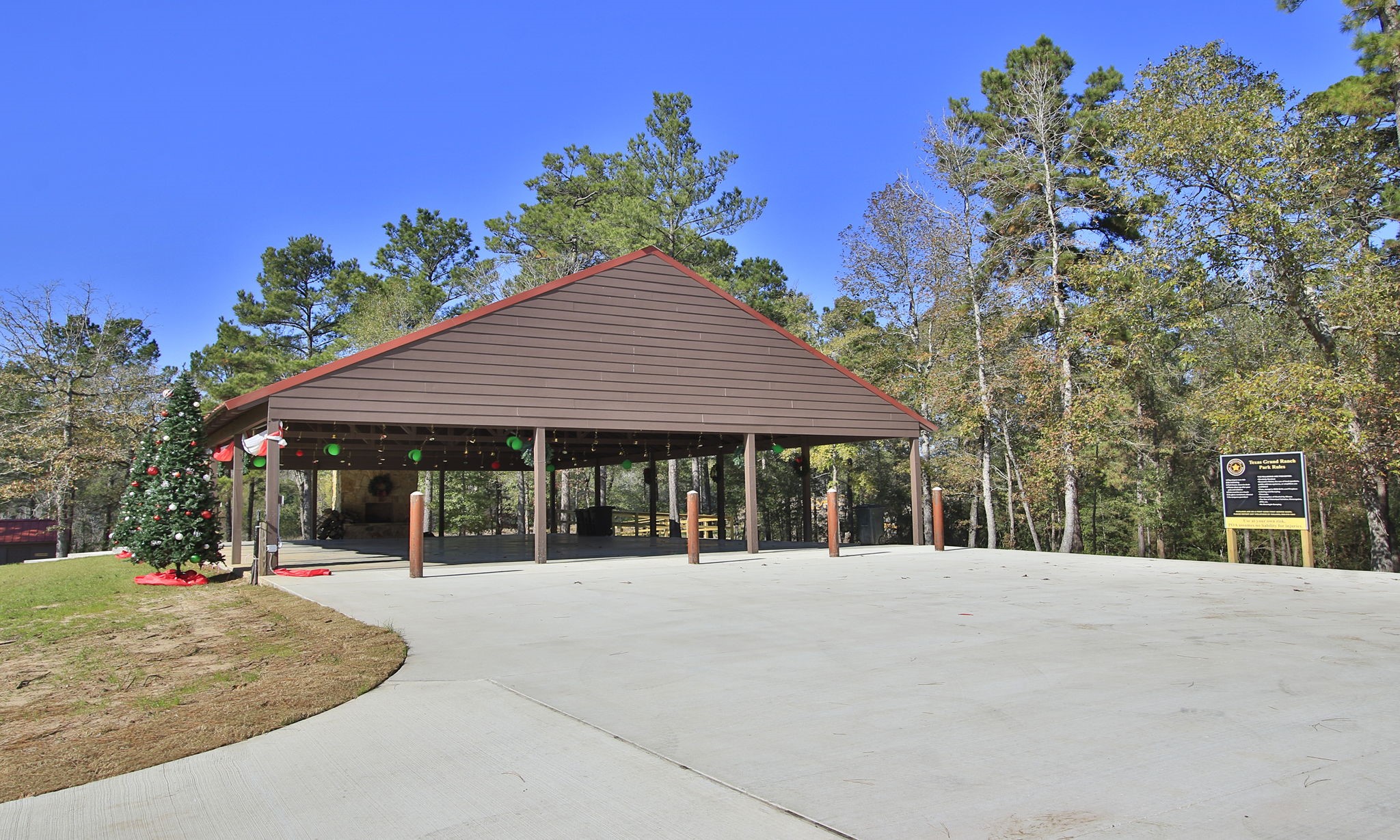 Lot 189 Branding Iron Road Huntsville, TX 77340 - Photo 33 of 48 a view of a white house with a outdoor space