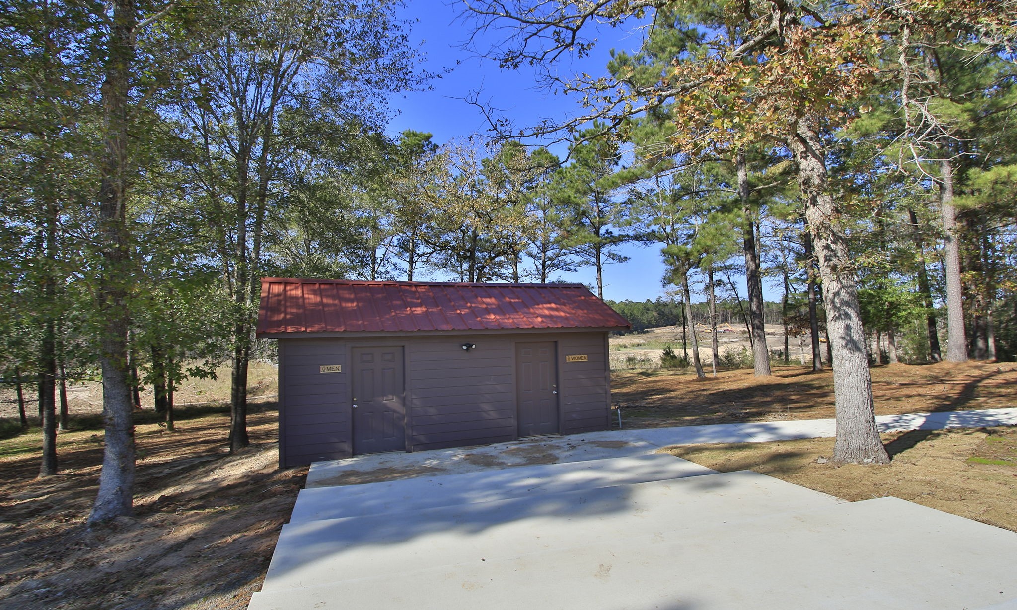 Lot 189 Branding Iron Road Huntsville, TX 77340 - Photo 36 of 48 a front view of a house with a garden
