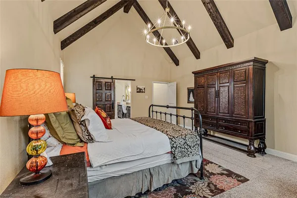 a bedroom with bed and wooden floor