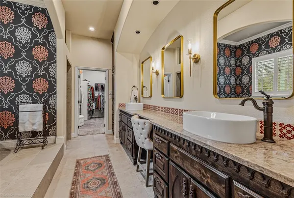 a hall with a sink and a wooden floor