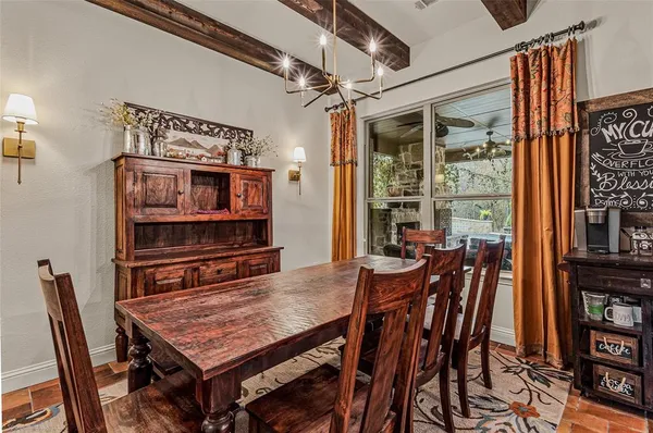 a dining room with a table and chairs