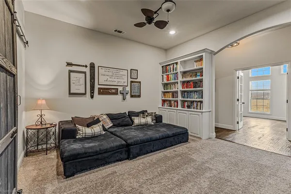 a living room with furniture and window