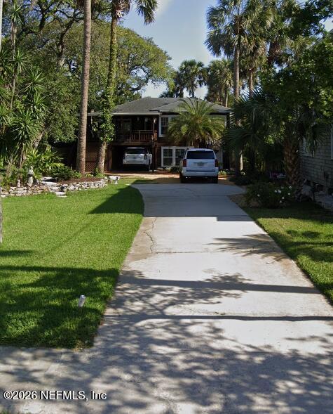 a front view of a building with garden