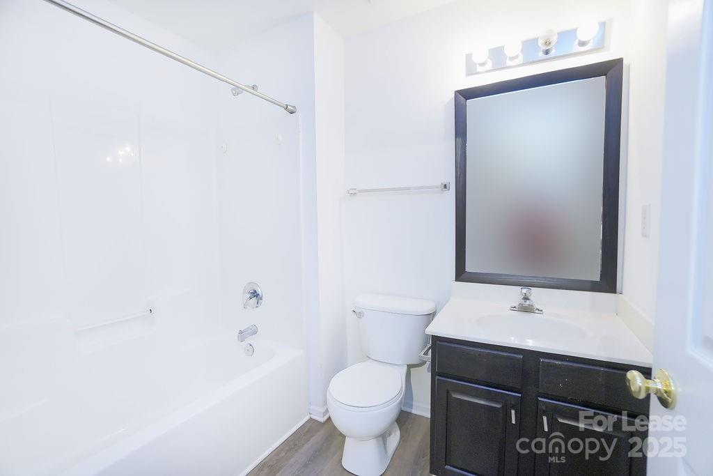 9858 Treeside Lane Matthews, NC 28105 - Photo 15 of 22 a bathroom with a sink toilet and shower