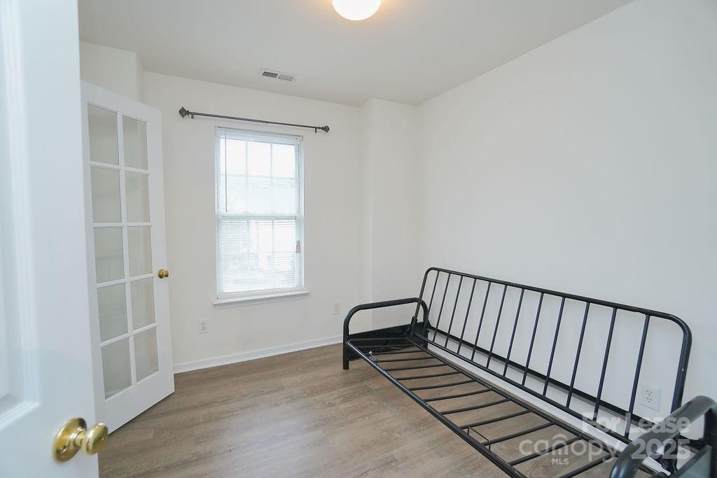 9858 Treeside Lane Matthews, NC 28105 - Photo 16 of 22 a view of a hallway with wooden floor and a window