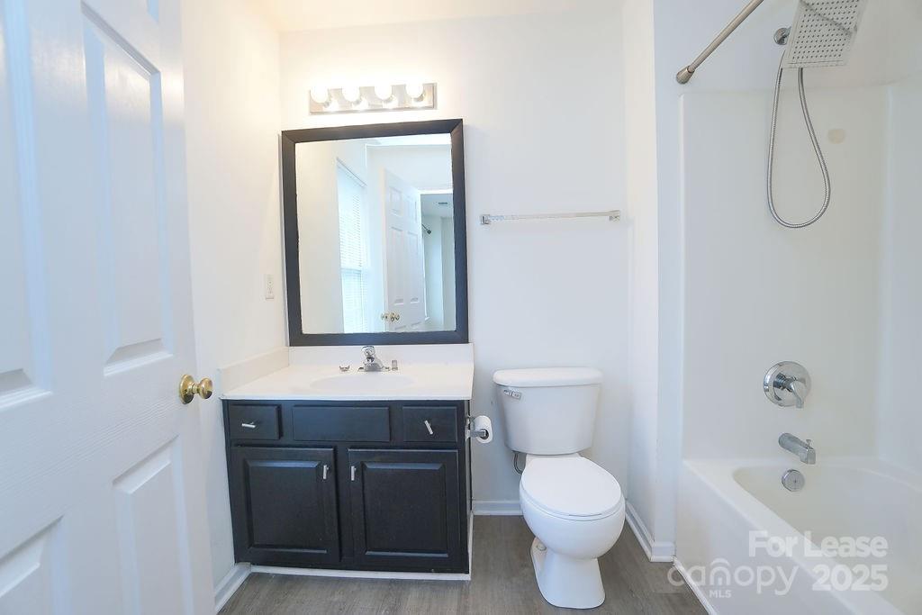 9858 Treeside Lane Matthews, NC 28105 - Photo 21 of 22 a bathroom with a granite countertop sink toilet and shower