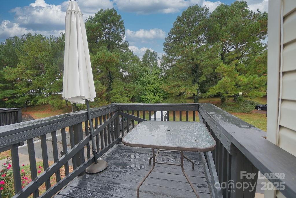 9858 Treeside Lane Matthews, NC 28105 - Photo 22 of 22 a view of a wooden bench and floor