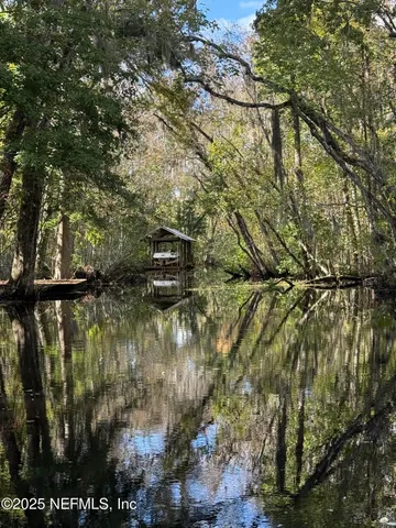 a front view of a house with a garden area
