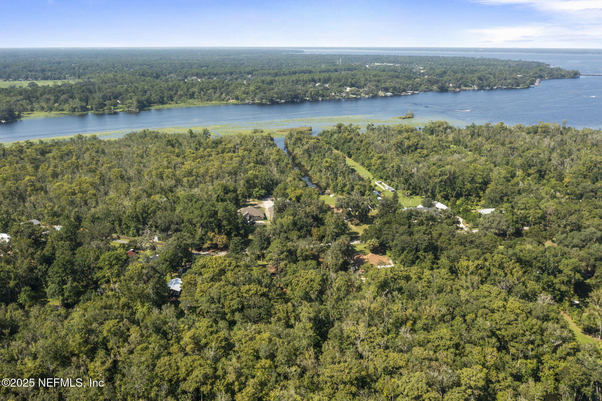 0 Hillwood Road Jacksonville, FL 32223 - Photo 23 of 35 a view of a lake with beach and city view